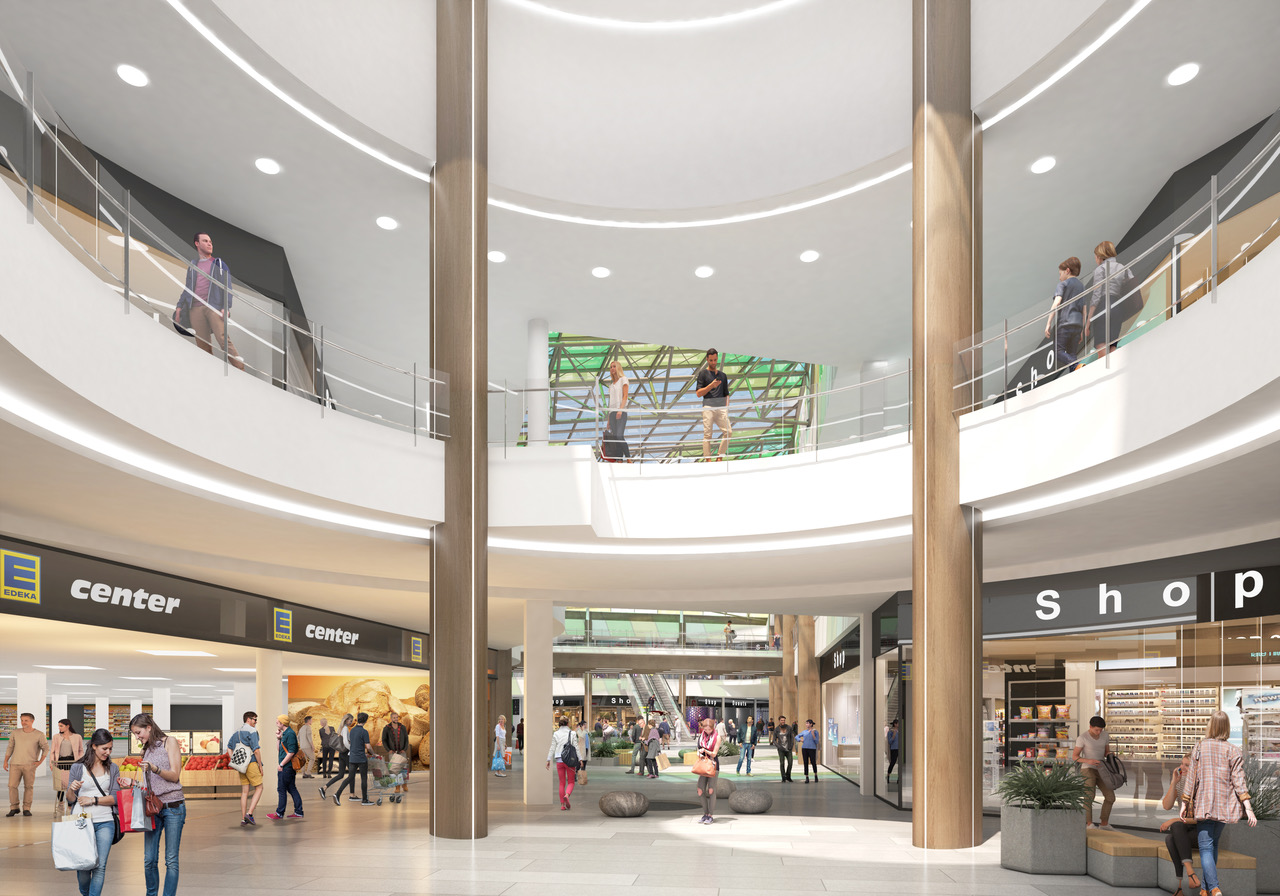 Rendering des Innenbereichs im Park Center Treptow: Eingang des EDEKA E-Centers im Erdgeschoss, darüber ein runder Luftraum mit umlaufenden Galerien und Rolltreppen.